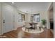 Bright dining room features hardwood floors, a decorative chandelier, and an ornate window at 1670 E Joseph Way, Gilbert, AZ 85295