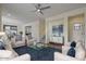 Open living room with multiple seating areas and a view of the staircase at 1670 E Joseph Way, Gilbert, AZ 85295