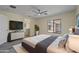 Spacious main bedroom with large bed and plenty of natural light at 1670 E Joseph Way, Gilbert, AZ 85295