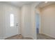 Bright front foyer features neutral colors and tile flooring with a glass accented front door at 43594 W Bravo Ct, Maricopa, AZ 85138