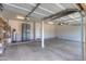 A spacious three-car garage is equipped with a water filtration system and plenty of room for storage at 43594 W Bravo Ct, Maricopa, AZ 85138