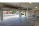 A three-car garage is open and gives a view of the beautiful neighborhood at 43594 W Bravo Ct, Maricopa, AZ 85138