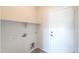 Convenient laundry room with a shelf, utility hookups, and a tiled floor at 43594 W Bravo Ct, Maricopa, AZ 85138