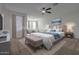 Large main bedroom with plush carpet and neutral decor at 43594 W Bravo Ct, Maricopa, AZ 85138