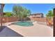 Private backyard pool with concrete surround, brick perimeter walls, and desert landscaping at 43594 W Bravo Ct, Maricopa, AZ 85138