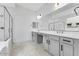 A spacious bathroom showcasing double sinks, large mirrors, and a large glass shower at 5845 S Romano --, Mesa, AZ 85212
