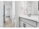 Modern bathroom featuring a white vanity with gray cabinets and wood look tile flooring at 5845 S Romano --, Mesa, AZ 85212