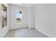 Bedroom displaying window, light-colored walls, light wood-look flooring, and bright, sunny view at 5845 S Romano --, Mesa, AZ 85212