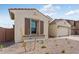 Attractive single-story home with stone accents and a well-manicured front yard at 5845 S Romano --, Mesa, AZ 85212