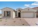 Charming single-story home with desert landscaping, inviting entrance, and a two-car garage at 5845 S Romano --, Mesa, AZ 85212