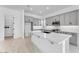 Open kitchen featuring gray cabinets, island, and walk-in pantry at 5845 S Romano --, Mesa, AZ 85212