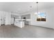 Bright living room with gray cabinets, a modern island, and tile flooring at 5845 S Romano --, Mesa, AZ 85212