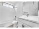 Bright bathroom featuring white cabinets, a single sink, and a shower-tub combination at 5851 S Romano --, Mesa, AZ 85212