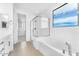 Modern bathroom with a soaking tub, glass shower, and walk-in closet at 5851 S Romano --, Mesa, AZ 85212