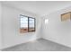 Bedroom featuring neutral carpet, white walls, and a view of the neighborhood at 5851 S Romano --, Mesa, AZ 85212