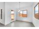 Bright dining room with modern lighting and backyard access at 5851 S Romano --, Mesa, AZ 85212