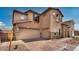 Charming two-story home featuring a three-car garage, appealing architecture, and a welcoming front yard at 5851 S Romano --, Mesa, AZ 85212