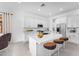 Bright kitchen features a central island, stainless steel appliances, and white cabinets at 5851 S Romano --, Mesa, AZ 85212