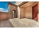 Private patio featuring stone walls, pavers, and a gate, perfect for outdoor relaxation at 5851 S Romano --, Mesa, AZ 85212