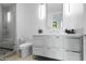 Modern bathroom with a walk-in shower and vanity at 6862 E Joshua Tree Ln, Paradise Valley, AZ 85253