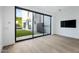 Sliding glass doors open to backyard; hardwood floors at 6862 E Joshua Tree Ln, Paradise Valley, AZ 85253