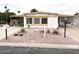 Charming single-story home with desert landscaping and a covered carport at 8257 E Dutchman Dr, Mesa, AZ 85208