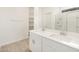Bathroom featuring double sink vanity and mirror at 16034 W Desert Hollow Dr, Surprise, AZ 85387