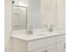 Bathroom featuring a large mirror above double sinks at 16034 W Desert Hollow Dr, Surprise, AZ 85387