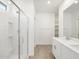 Bathroom featuring walk-in shower and double sink vanity at 16034 W Desert Hollow Dr, Surprise, AZ 85387