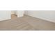 A bedroom area with fresh neutral colored carpet at 16034 W Desert Hollow Dr, Surprise, AZ 85387