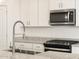 Updated kitchen featuring stainless steel appliances and granite countertops at 16034 W Desert Hollow Dr, Surprise, AZ 85387