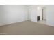 This large bedroom features neutral carpeting, ample closet space and natural light at 16062 W Prickly Pear Trl, Surprise, AZ 85387