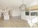 Open concept dining room with kitchen view and chandelier at 4027 S 177Th Ln, Goodyear, AZ 85338