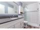 Modern bathroom with white vanity, sleek countertops, walk-in shower, and contemporary finishes at 4937 N Granite Reef Rd, Scottsdale, AZ 85251