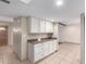 Open kitchen view with granite counters and ample white cabinetry, connecting seamlessly to the living space at 4937 N Granite Reef Rd, Scottsdale, AZ 85251