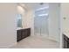 Contemporary bathroom featuring a glass-enclosed shower, quartz countertop and dark wood vanity at 25153 N 177Th Dr, Surprise, AZ 85387