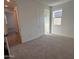 Bright bedroom featuring neutral wall tones and carpet at 4267 E Bradford Ave, San Tan Valley, AZ 85143