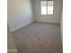 Well-lit bedroom with neutral walls and carpeted floors at 4267 E Bradford Ave, San Tan Valley, AZ 85143