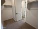 Large walk-in closet with double hanging rods and shelving at 4267 E Bradford Ave, San Tan Valley, AZ 85143