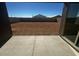 View from the covered patio overlooking the spacious backyard with dirt landscaping, providing a blank canvas for outdoor living at 4317 E Bradford Ave, San Tan Valley, AZ 85143