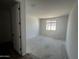 Unfinished bedroom featuring a window and closet at 4317 E Bradford Ave, San Tan Valley, AZ 85143