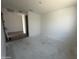 Bright, unfinished bedroom with tile floors leading to other rooms at 4317 E Bradford Ave, San Tan Valley, AZ 85143