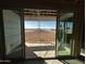 Sliding glass doors showcasing a view of the backyard from the interior at 4317 E Bradford Ave, San Tan Valley, AZ 85143