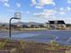 Basketball court with mountain views. Community offers recreational opportunities and green spaces for residents to enjoy at 4832 N 177Th Dr, Goodyear, AZ 85395