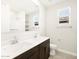 Bathroom with double sink vanity, tile floors, and a window above the toilet at 4832 N 177Th Dr, Goodyear, AZ 85395