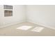 Light-filled bedroom with neutral carpet and a window at 4832 N 177Th Dr, Goodyear, AZ 85395