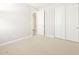 Bright bedroom with a closet behind double doors at 4832 N 177Th Dr, Goodyear, AZ 85395