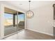 Dining area featuring sliding glass doors to outdoor patio and modern pendant lighting at 4832 N 177Th Dr, Goodyear, AZ 85395