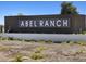 Community entrance sign reading 'Abel Ranch', surrounded by desert landscaping and gravel at 4862 N 177Th Dr, Goodyear, AZ 85395