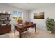 Home office with a large wooden desk and built-in shelving at 8119 E Desert Trl, Mesa, AZ 85208